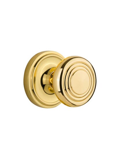 Classic Rosette Door Set with Streamline Deco Knobs in Polished Brass.